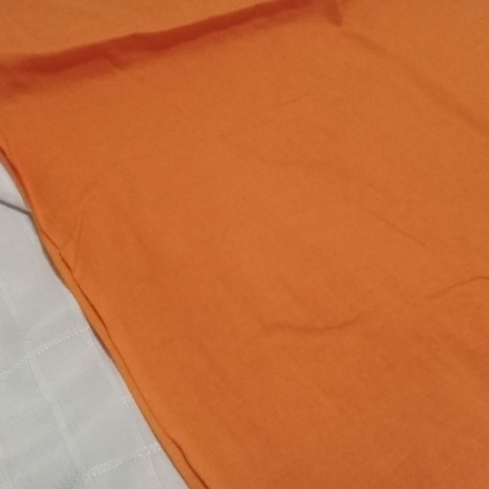 Luxurious cotton and spandex fabric, solid orange color. Slightly stretchy.